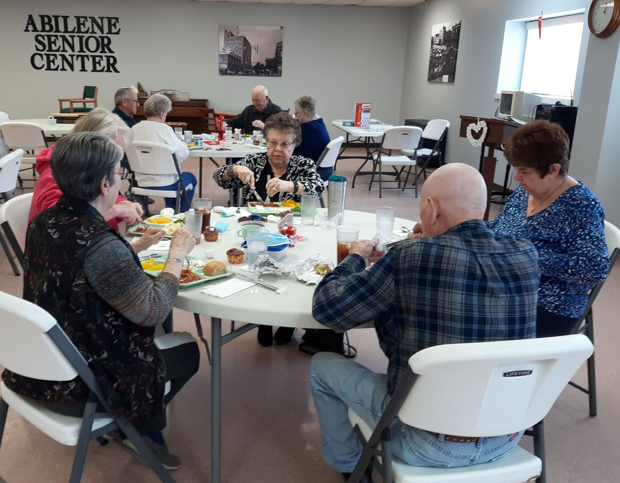 People visiting over lunch at the Abilene Senior Center