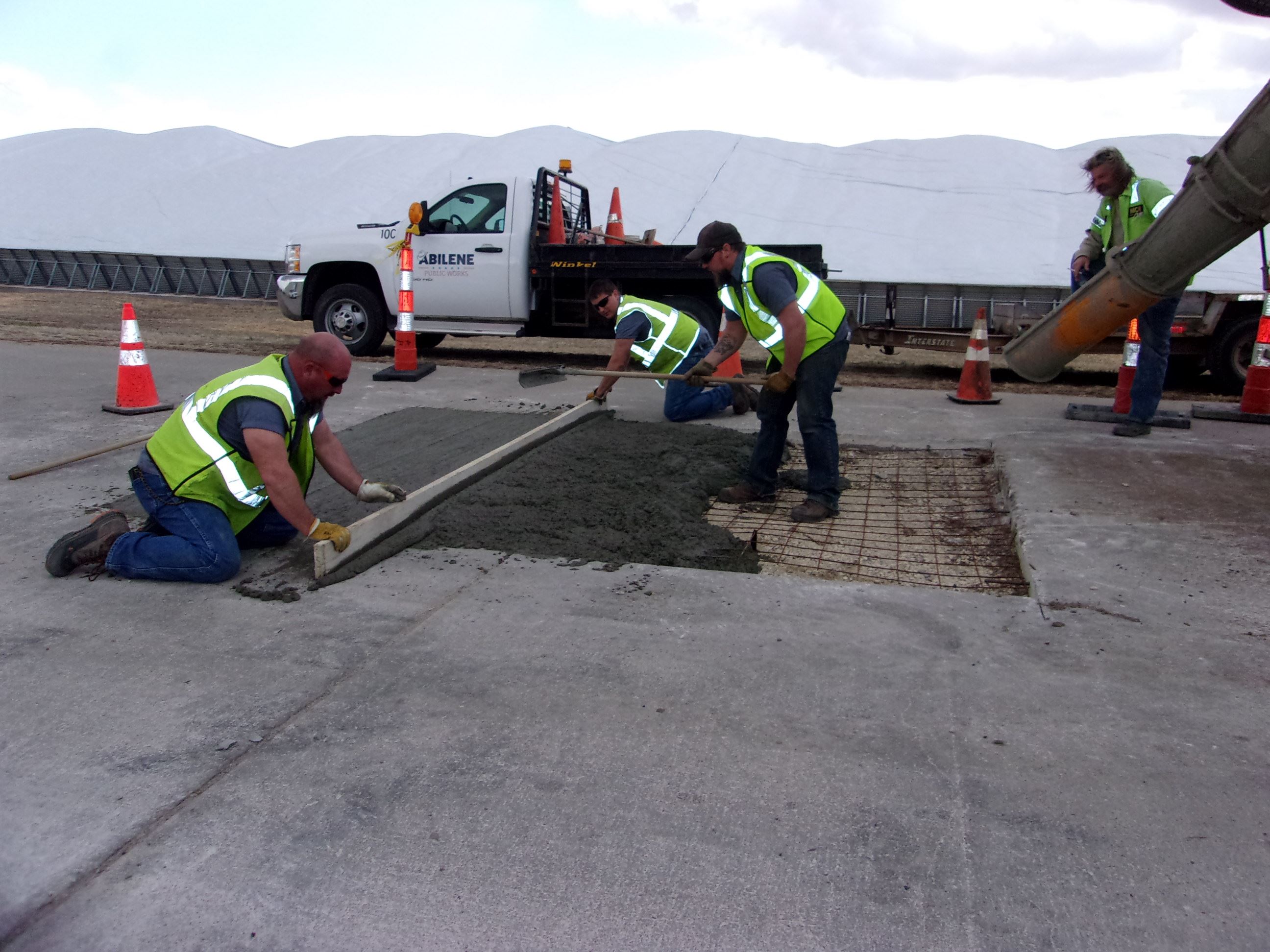 Street Crew Smoothing out Concrete